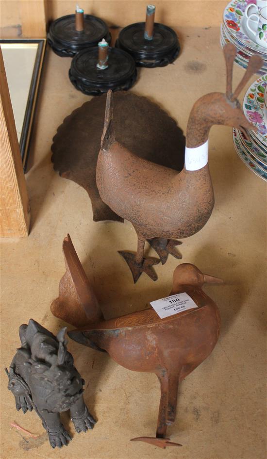 Two Persian iron bird figures, Burmese bronze lion & 3 carved stands